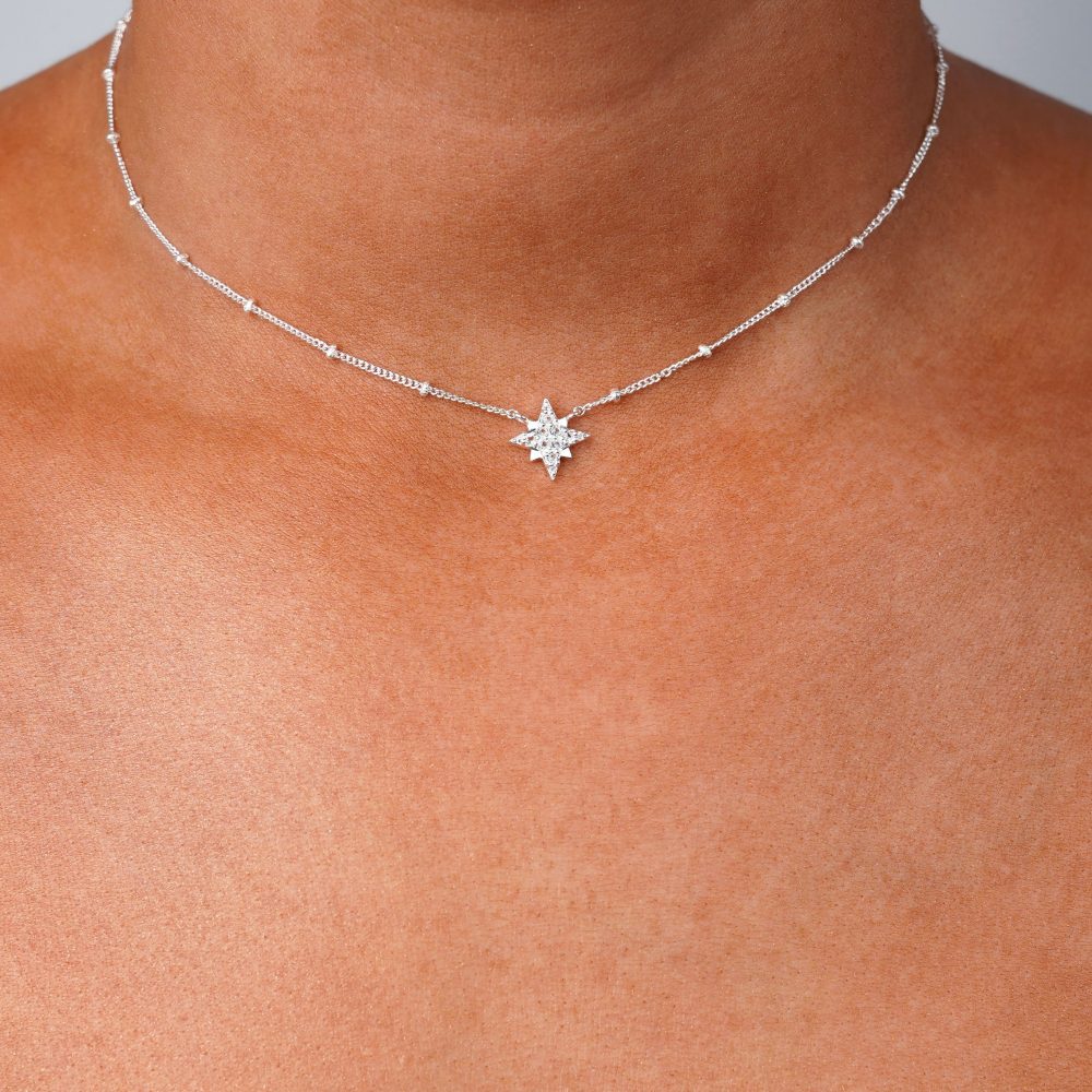 Star necklace in silver and with White Topas crystals. Silver necklace with sparkling star made of genuine gemstones.