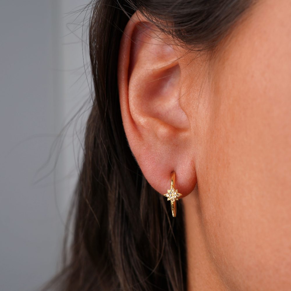 Hoops earrings with star filled with White topaz crystals. Beautiful gold earrings with sparkling star of crystals.