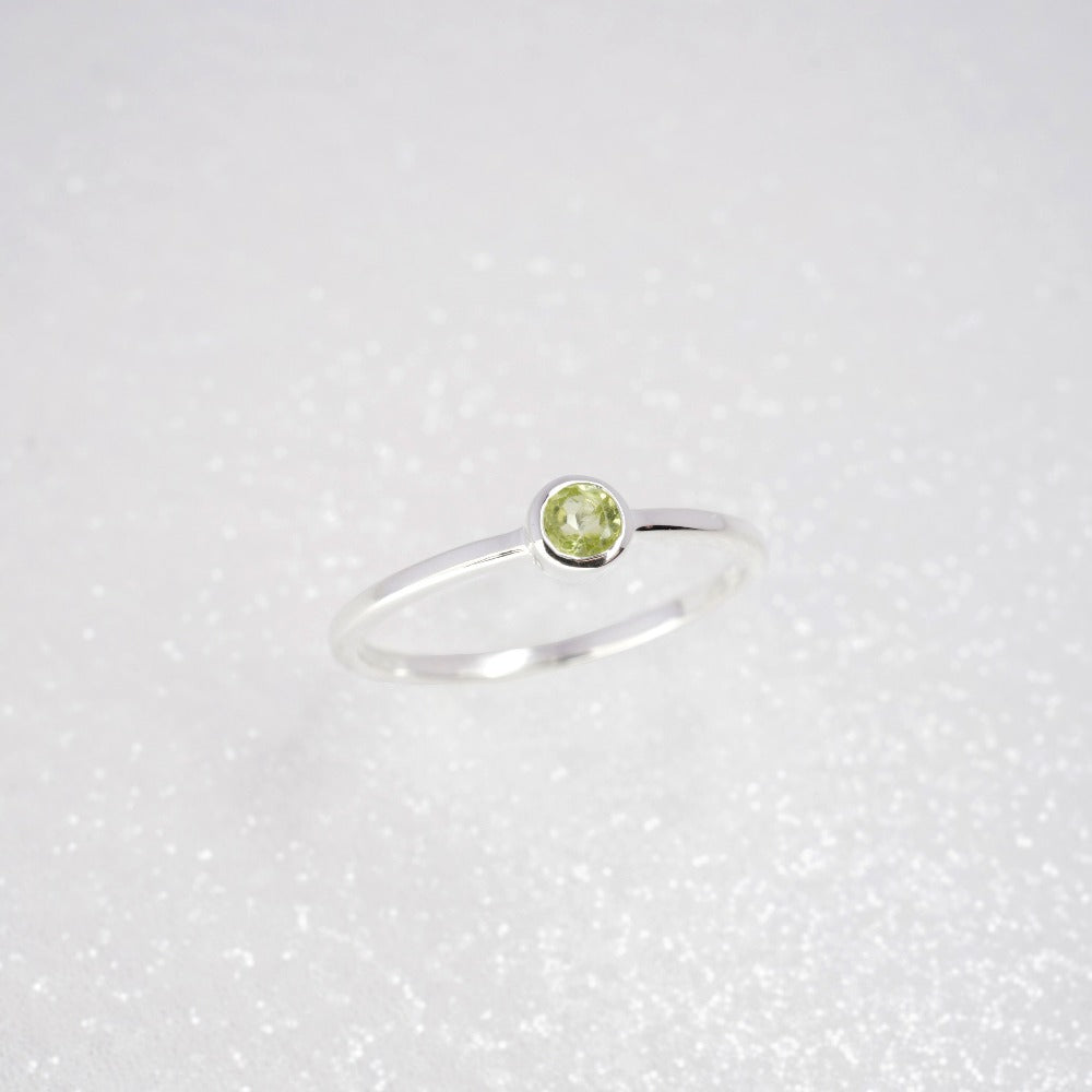 Silver ring with gemstone Peridot in an elegant and modern design. Ring with green crystal Peridot which is August's birthstone.