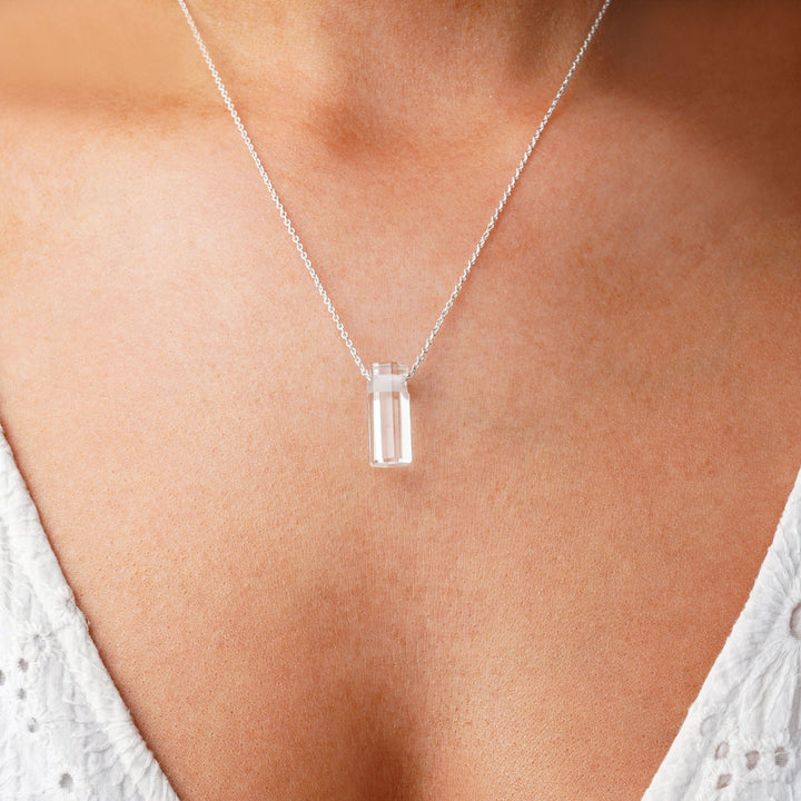 Crystal pendant with Clear Quartz in gold necklace. Gemstonej jewelry with Clear Quarts, the birthstone of April.