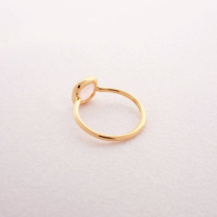 Gold ring with crystal Rose quartz, which is October's birth stone. Ring with crystal Rose quartz that stands for love.