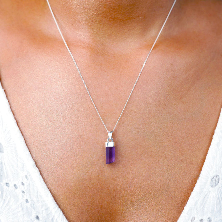 Necklace with Amethyst point, which is the birthstone of February. Jewelry with an Amethyst point that is worn as a necklace and serves as protection.