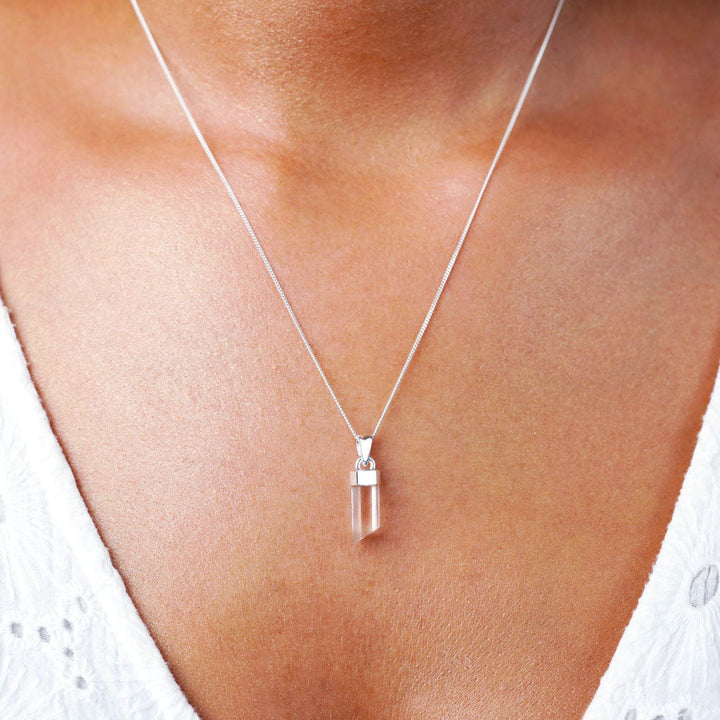 Clear Quartz point necklace in silver. April birthstone necklace. Jewelry with Clear Quartzl in a natural point.