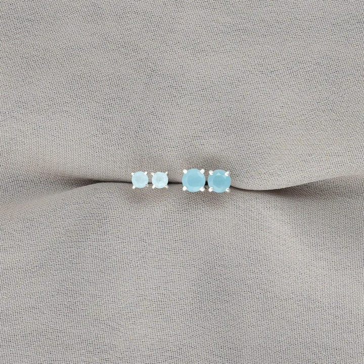 Silver earrings with blue crystal Aquamarine. Modern stud earrings in silver with Aquamarine crystal.