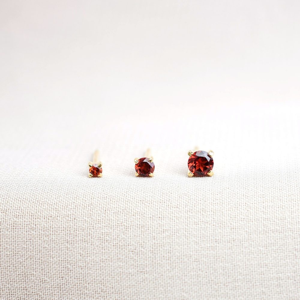 Jewelry with January's birthstone Garnet. Earrings with crystal red Garnet in gold.