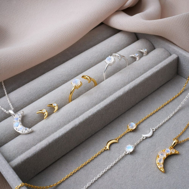  Crystal jewelry with moons and crystals. Luna collection in silver and gold with Rainbow Moonstone.