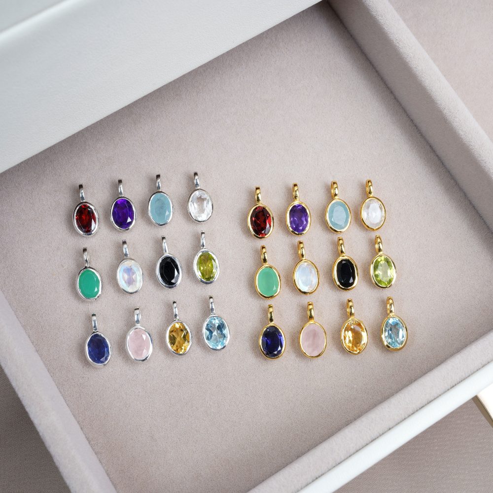 Birthstone pendants in different colors. Crystal pendants with different crystals and colors.