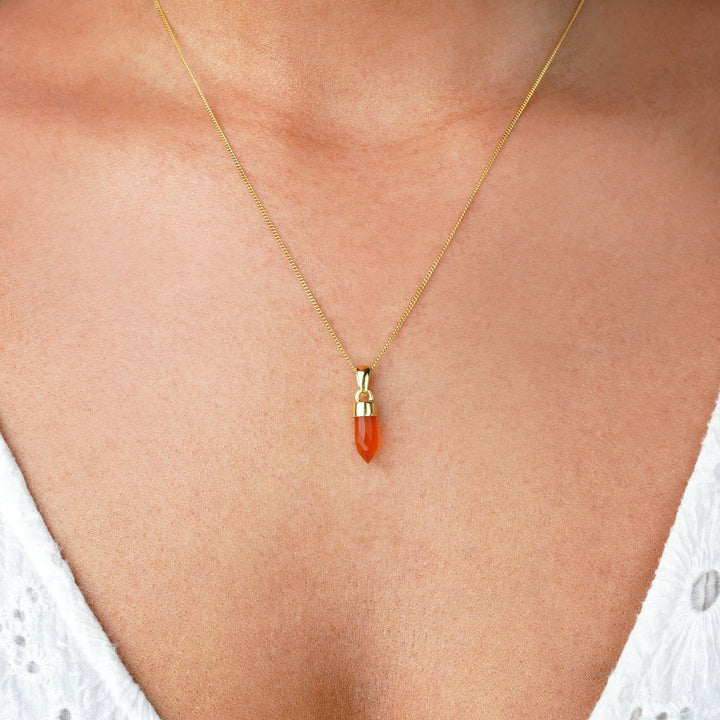 Carnelian jewelry as a necklace. Crystal Carnelian is an orange gemstone that brings joy.