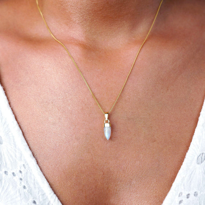 Jewelry mini point in Moonstone with gold details. Cute pendant with crystal Rainbow Moonstone to wear in necklace.