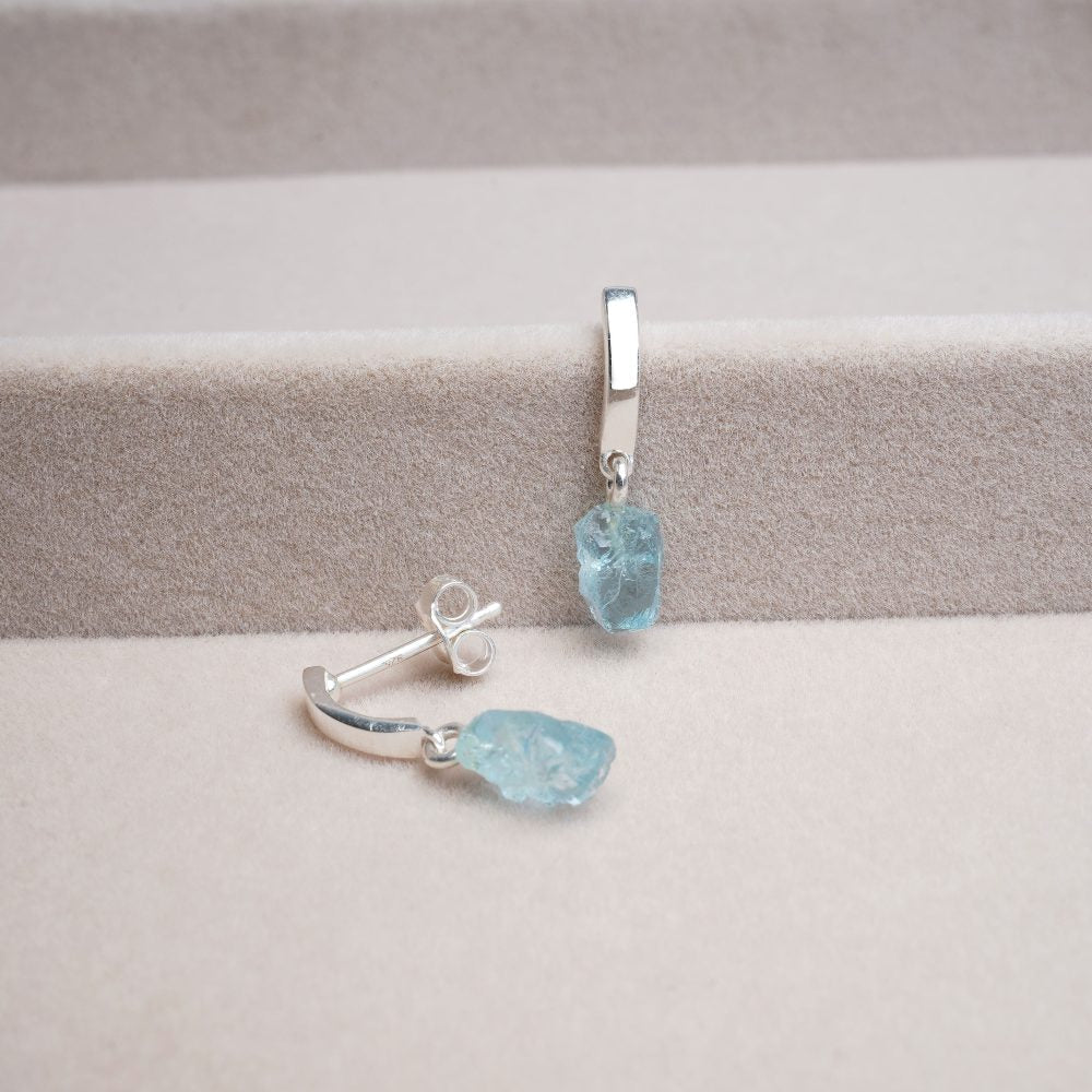 Modern silver earrings with blue crystal Aquamarine. Beautiful earrings in silver with blue stone Aquamarine.