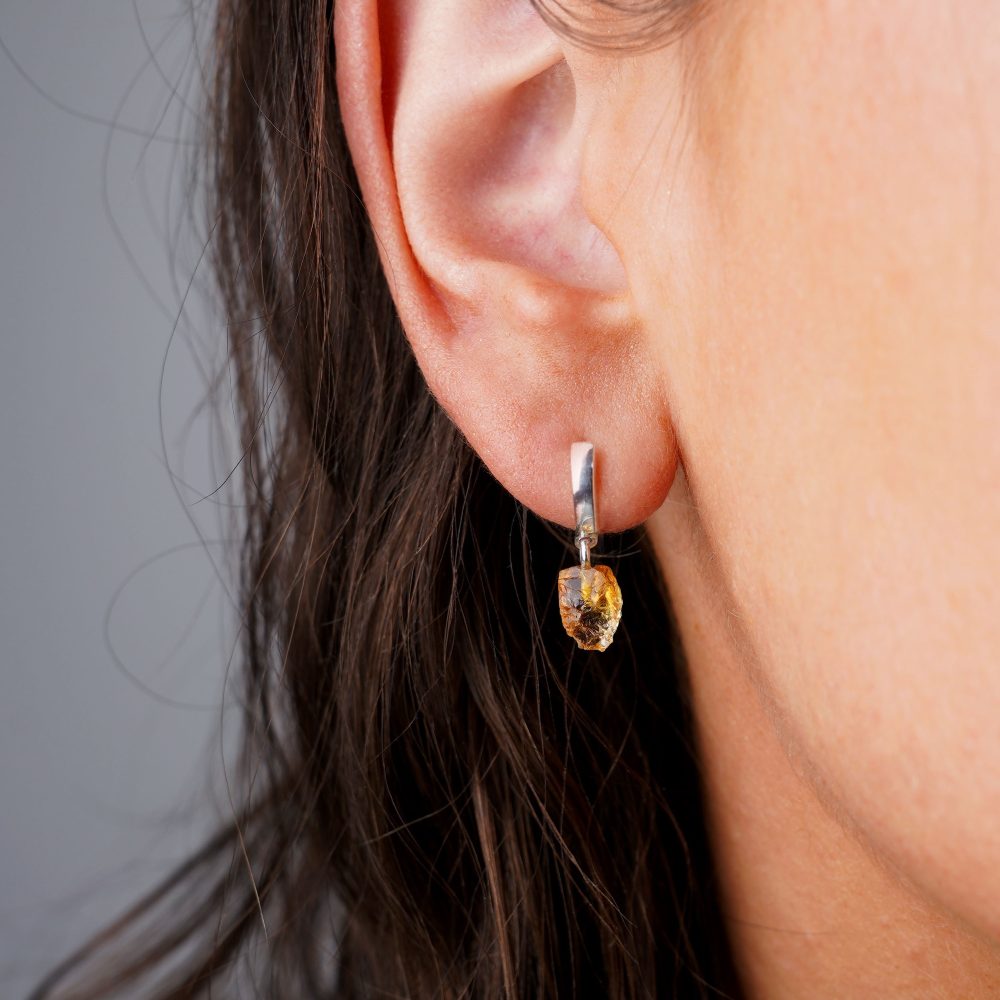 Earrings in silver with yellow crystal Citrine, which is November's birthstone. Silver earrings with yellow gemstone Citrine in a raw form.