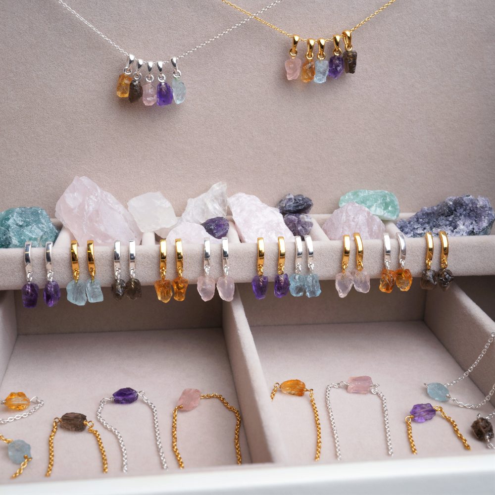 Jewelry with raw gemstones. Crystal jewelry with colorful  stones.