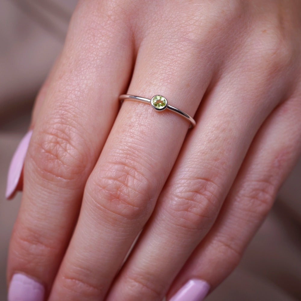  Silver ring with crystal Peridot. Modern gemstone ring with green Peridot, which is August's birthstone.