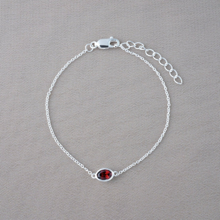Bracelet with January birthstone Garnet. Silver bracelet with red gemstone Garnet.