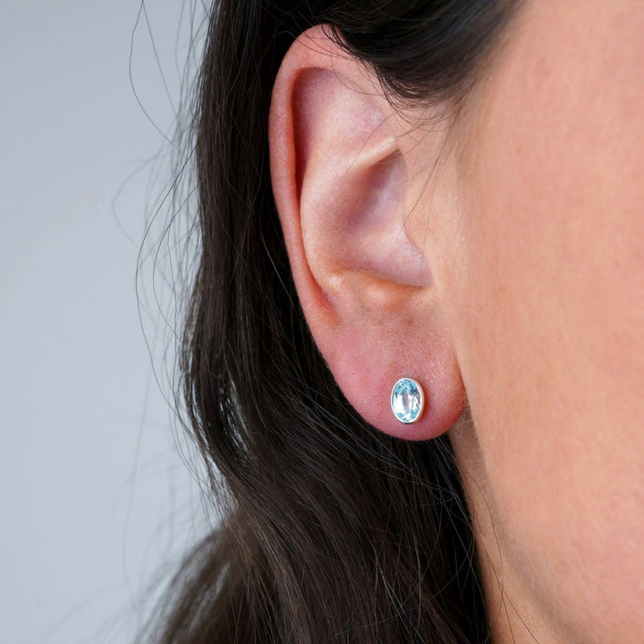 Crystal blue Topaz earrings in silver. Birthstone earrings for December with blue Topaz in silver.