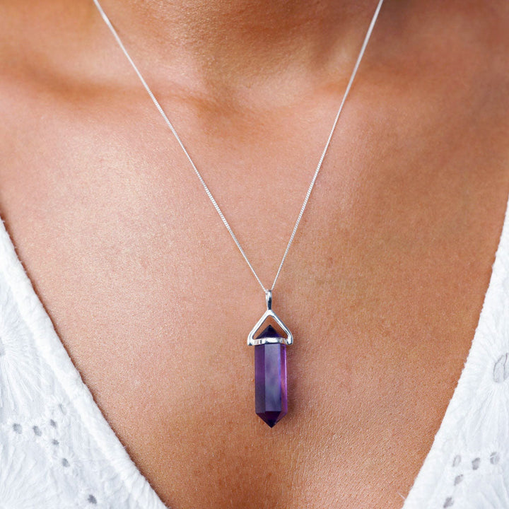 Jewelry with purple crystal Amethyst which is the birthstone of February. Point with Amethyst to wear as a necklace in sterling silver.