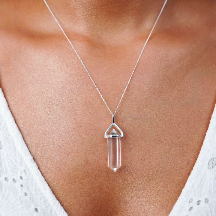 Clear Quartz point jewelry to wear as a necklace in sterling silver. Crystal jewelry with healing gemstone Clear Quartz.