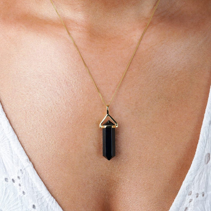 Point pendant with black crystal Onyx which is the birthstone of July. Necklace with black Onyx chaped into a point.