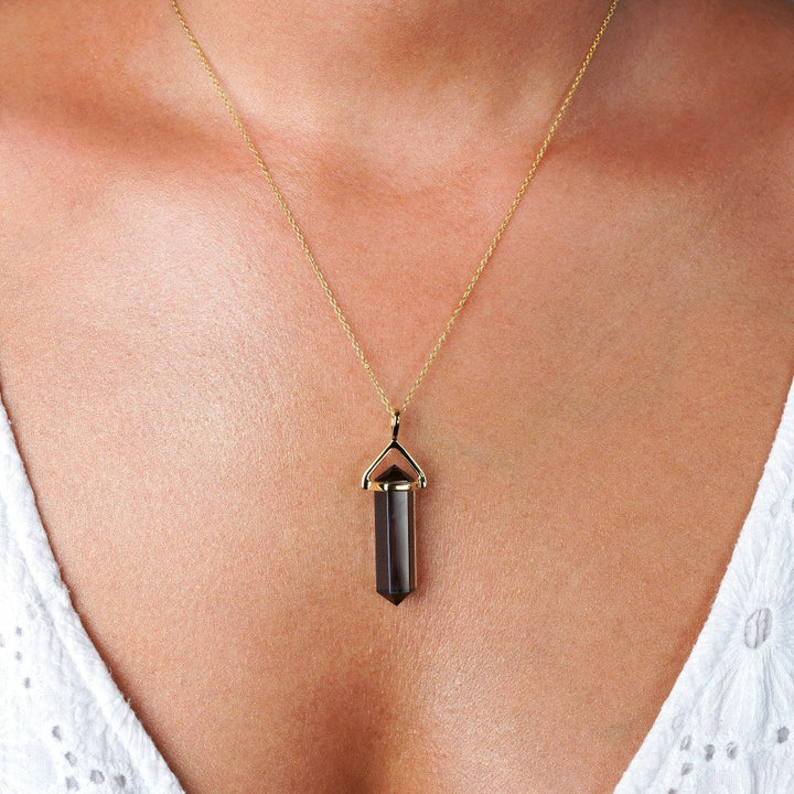 Point pendant with Smoky quartz in gold. Necklace with Smoky quartz in point model.