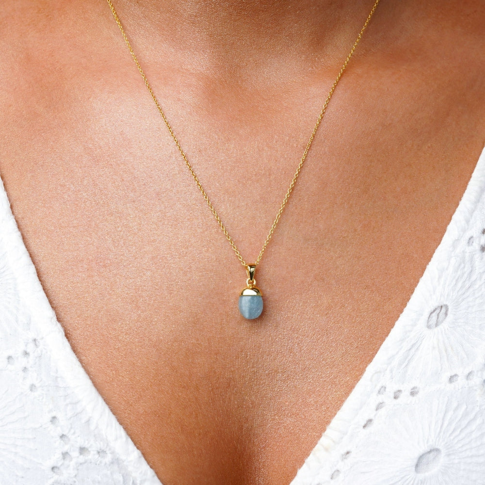 Aquamarine crystal jewelry in gold. Jewelery with blue aquamarine, the birthstone of March.