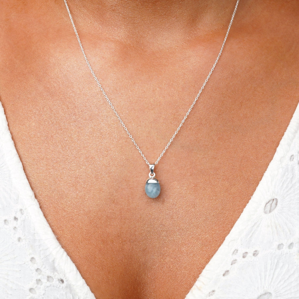 Aquamarine necklace in silver. Crystal jewelry with blue stone Aquamarine to wear as a necklace. Jewelery with blue crystal Aquamarine which is the birthstone of March.