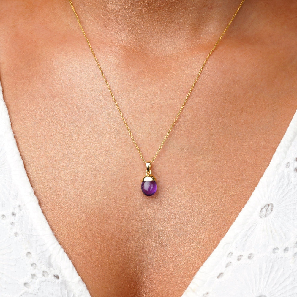 Amethyst necklace charged with protective energies. Jewelry with purple gemstone Amethyst to wear in a necklace.