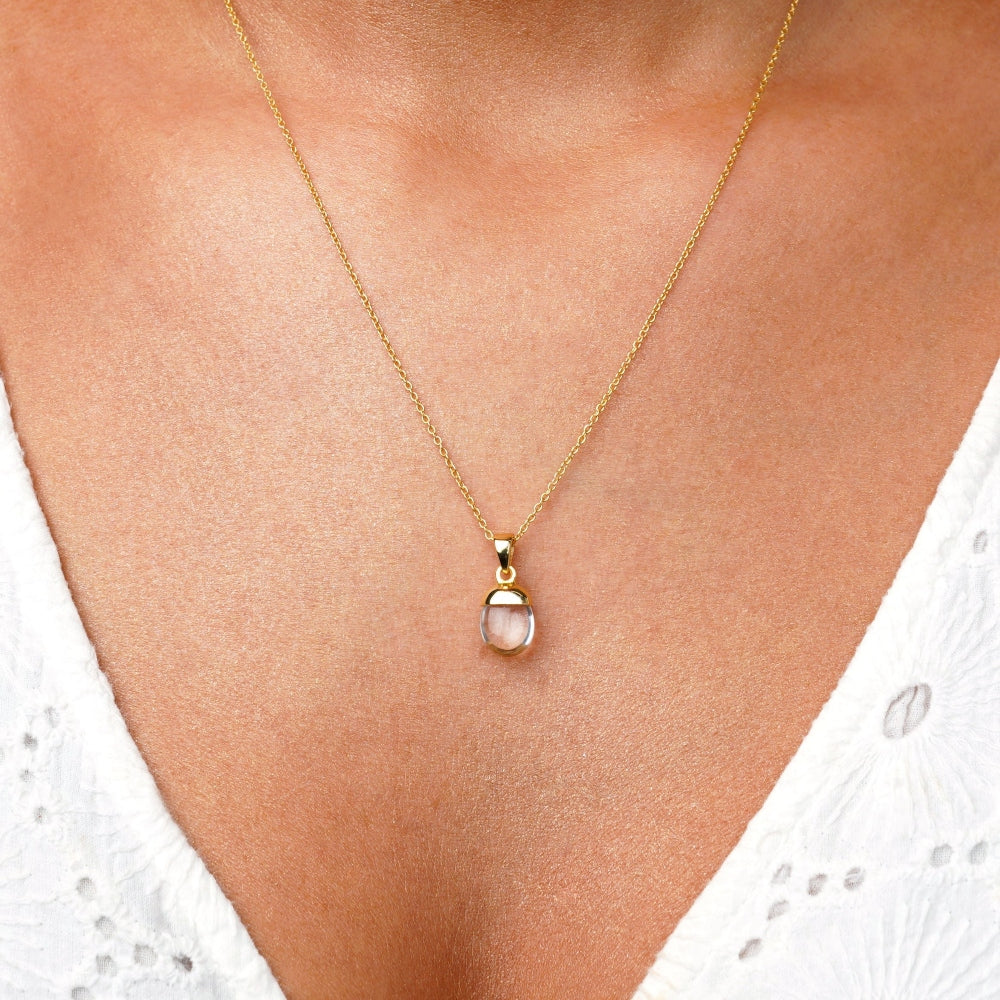 Clear Quartz necklace in gold with beautiful small tumbled charm. Jewelry with a pretty charm of Clear Quartz which is the birthstone of April.