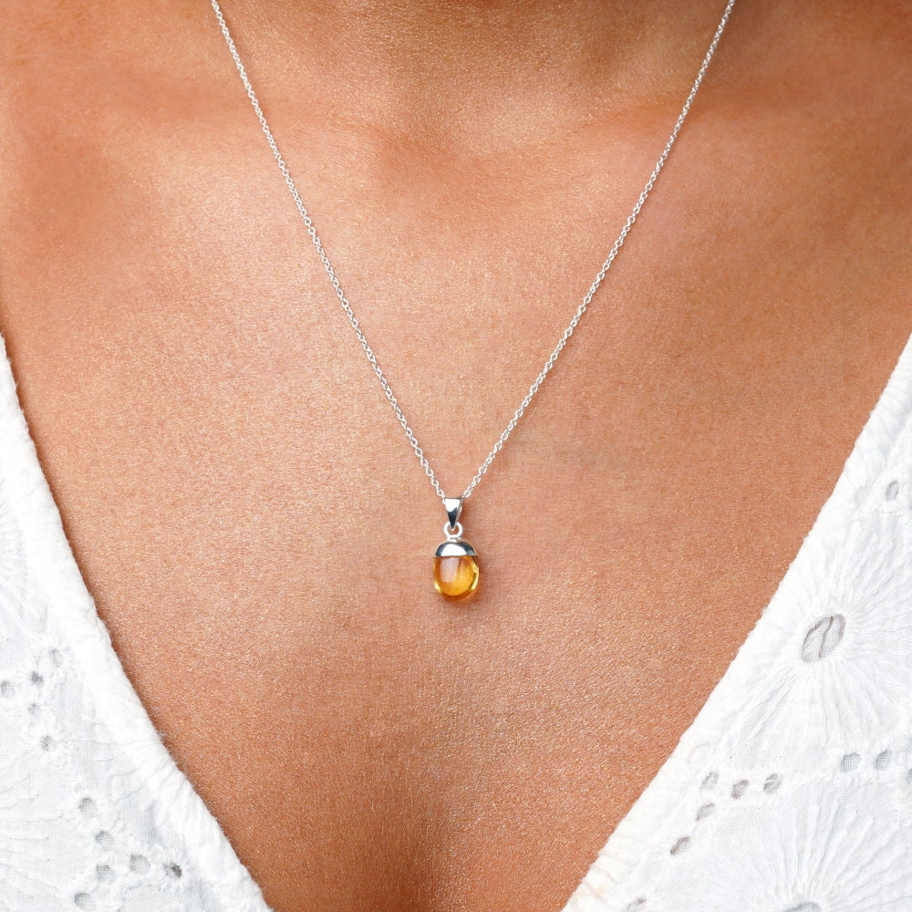 Necklace with small Citrine charm in silver. Jeweery with crystal Citrine which is the November birthstone.