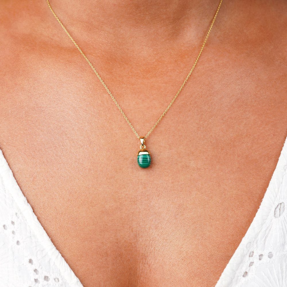 Gold necklace with green Malachite gemstone that has a beautiful pattern. Natural crystal Malachite charm to wear as a necklace.
