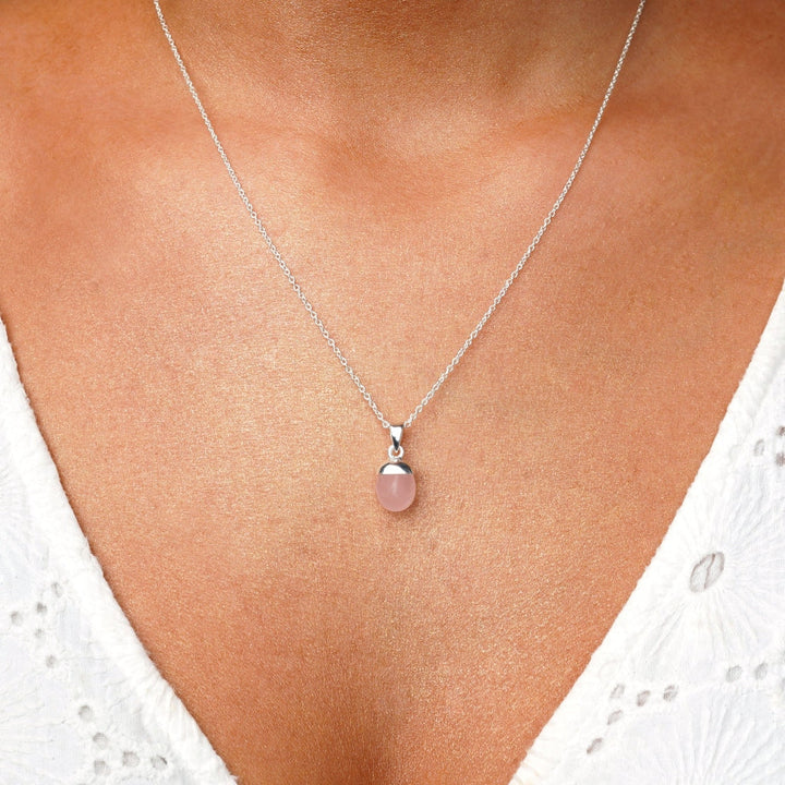 Pink gemstone Rose quartz in necklace with silver chain. Pink crystal Rose Quartz is October's birthstone and is beautiful to wear in a necklace.