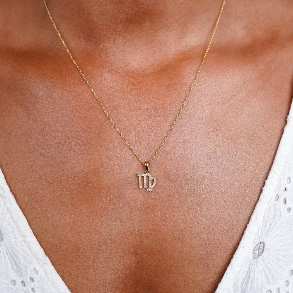 Gold necklace with Virgo (Virgin) sign. Gemstone necklace with zodiac sign Virgo filled with White Topaz crystals.