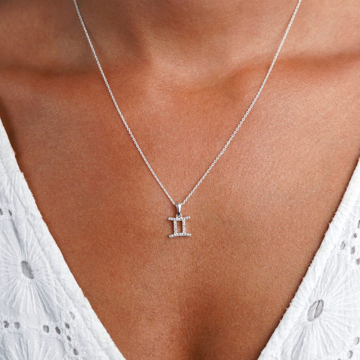 Zodiac sign necklace with Gemini (Twins). White Topaz necklace with Gemini symbol.